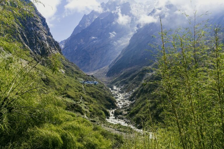Explore the breathtaking Annapurna landscape with towering mountains and lush greenery.